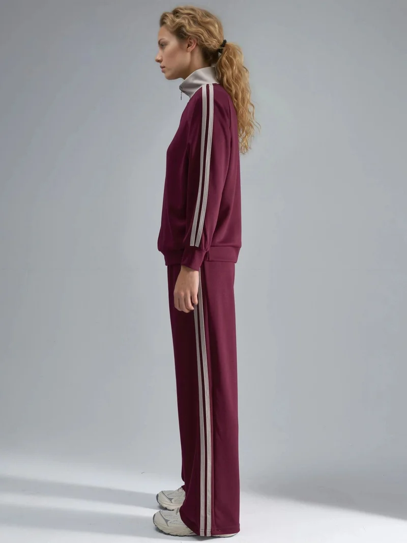 هيكاب طقم نسائي قطعتين مخطط بأرجل واسعة وياقة بسحاب من مجموعة بيرسان